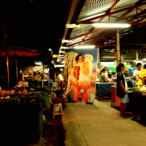 Araya Asdjarmrearnsook, Village and Elsewhere Jeff Koons Wolfman in Pakoitai Market and Sunday Market, 2011